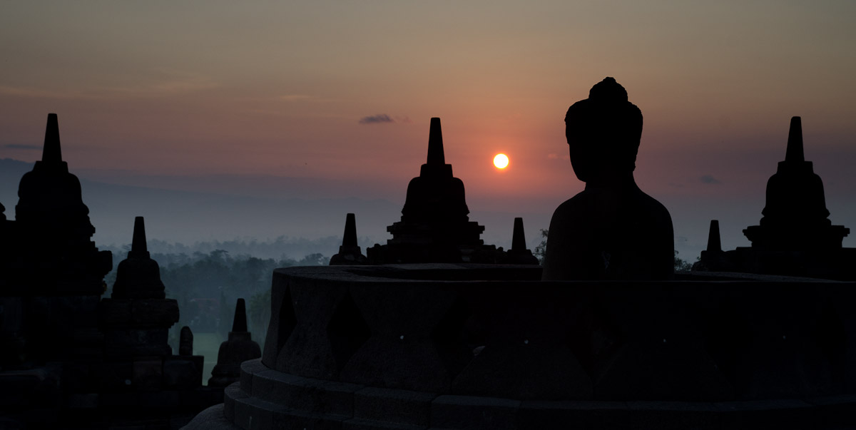 Sun rise over over Buddha statue
